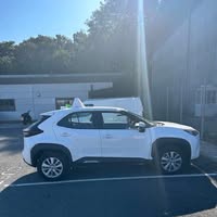 The white Toyota Hybrid Vehicle used for Manny Moves driving lessons